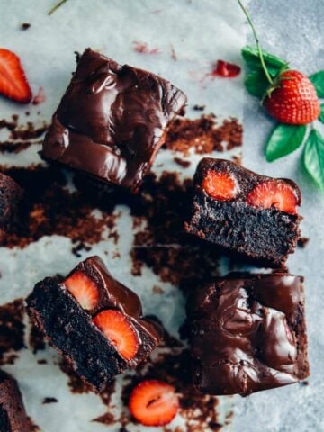 Chocolate strawberry brownies topped with a rich chocolate sauce