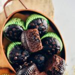 Healthy chocolate zucchini muffins in a copper pan.